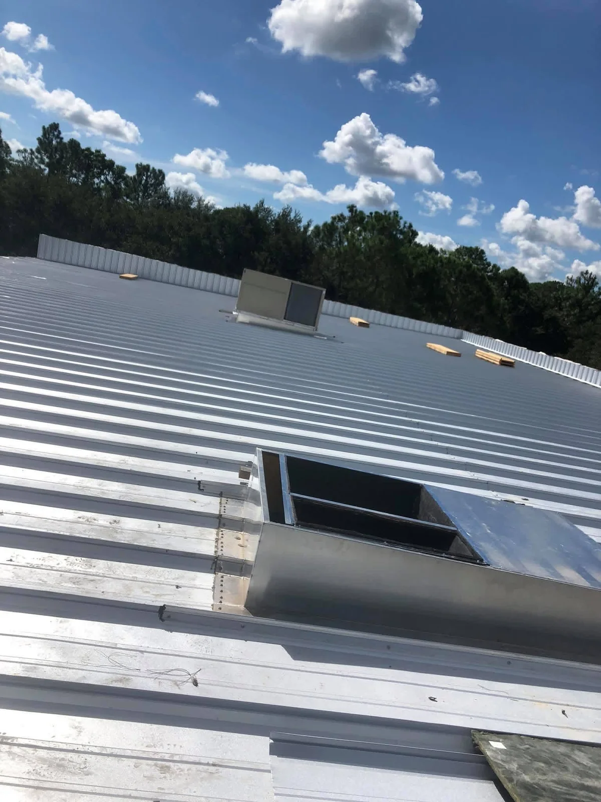 Rooftop ductwork curb and HVAC unit on a commercial building in Polk County FL by Anchored A/C